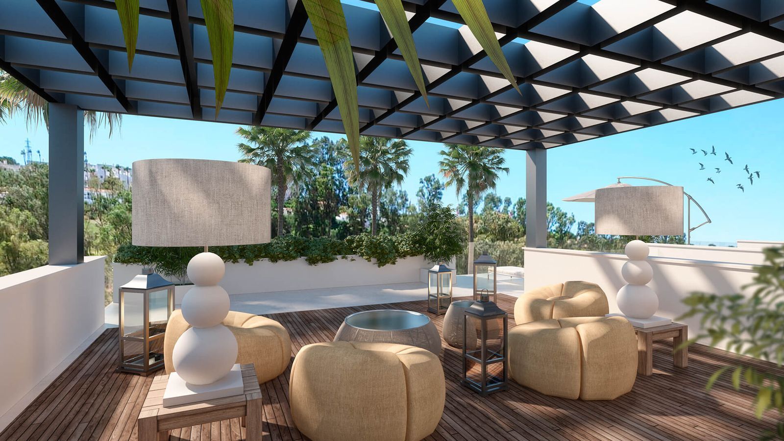 Moderne terras zithoek met comfortabele poefs en tropische sfeer.